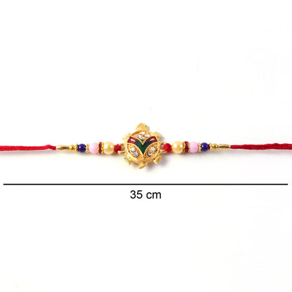 Traditional Tortoise Charm Rakhi with colorful highlights