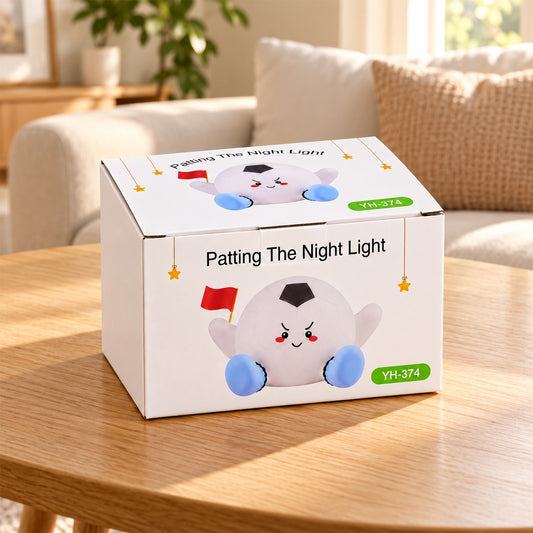 A white box with a cartoon football character and text sits on a wooden table in a living room.