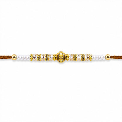 Minimal Pearl Golden Bracelet Rakhi with Sleek Beads and Elegant Red Thread