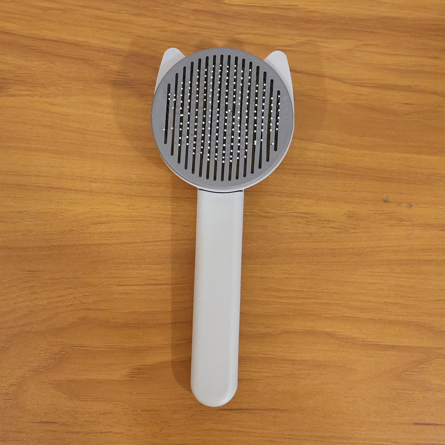 Reusable pet shedding needle comb