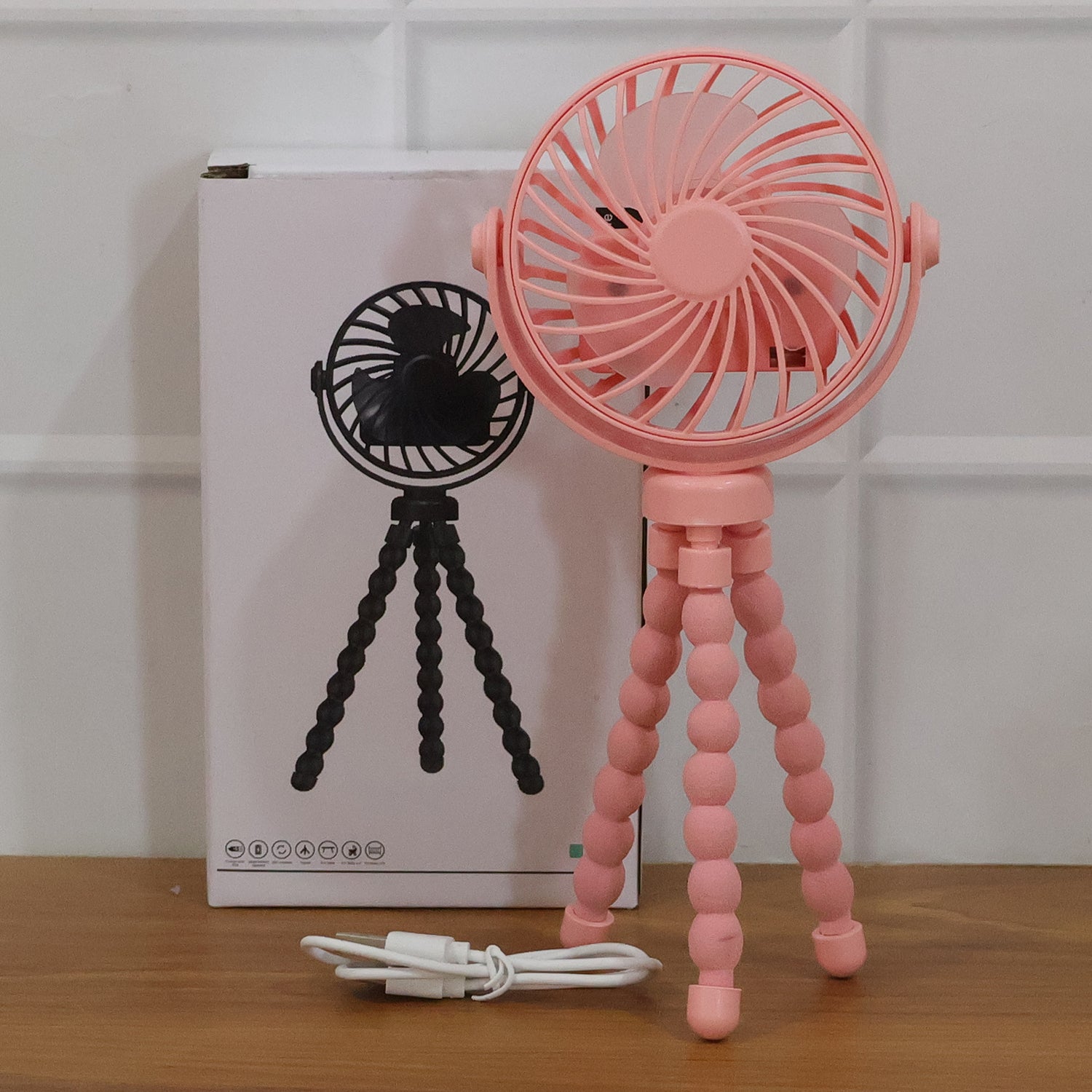 Flexible tripod fan wrapped around a pole