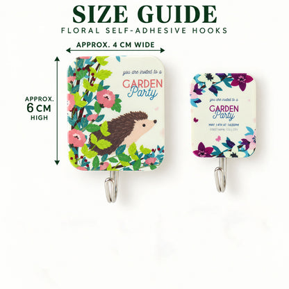 Two floral sticky hooks, one larger with a hedgehog and one smaller with purple flowers, showing approximate dimensions.