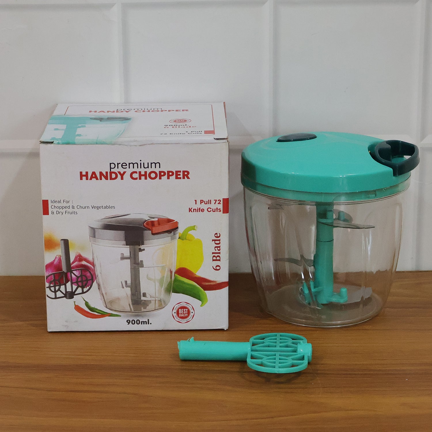 6 Blade 2in1 Manual Food Chopper next to fresh fruits and kitchen tools
