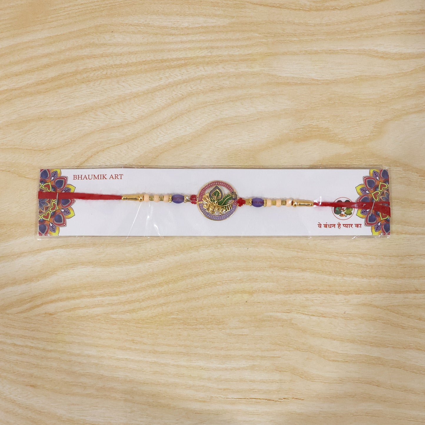 Colorful bead rakhi with traditional motifs