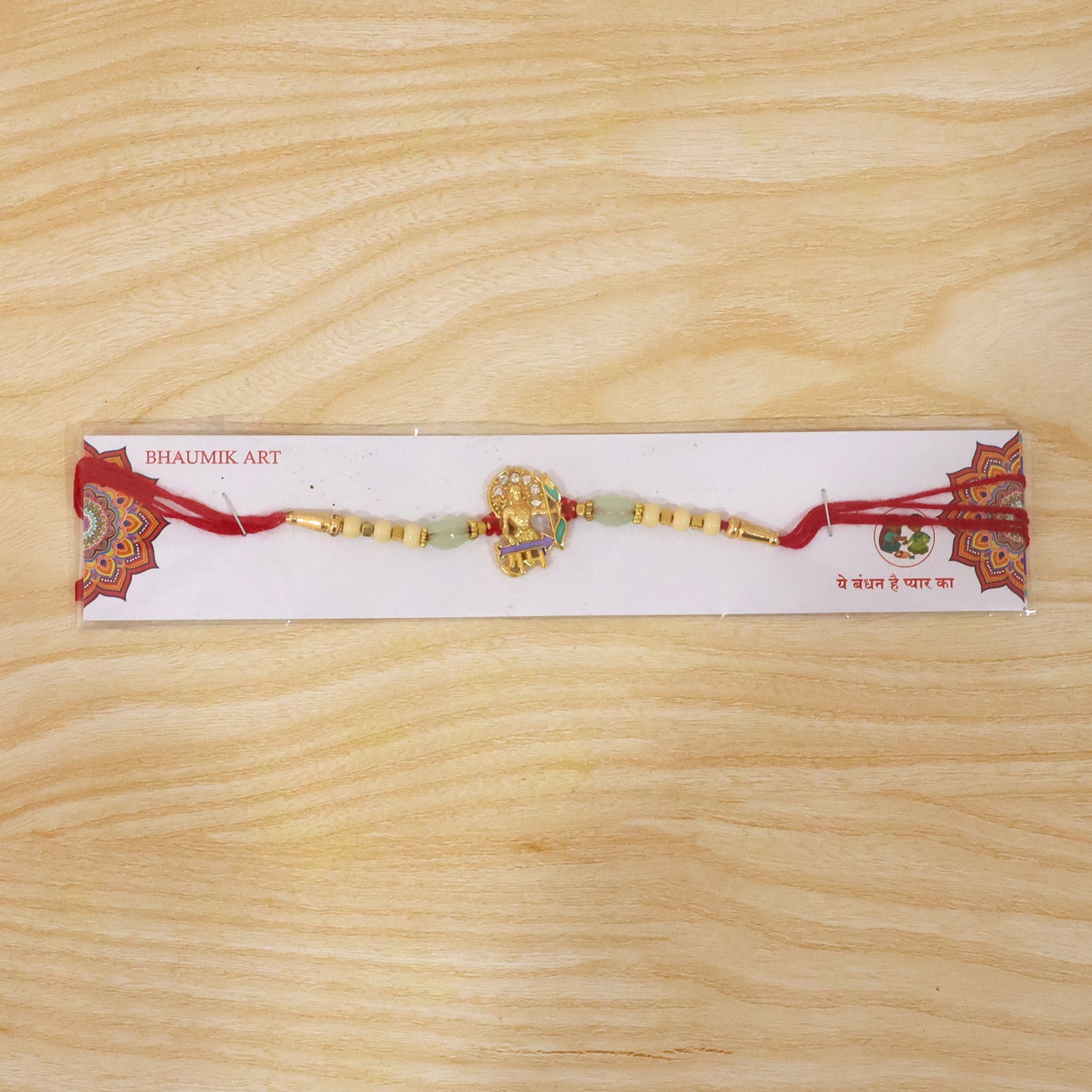 Full design of Gold Finish Lord Ram Rakhi with beads and thread