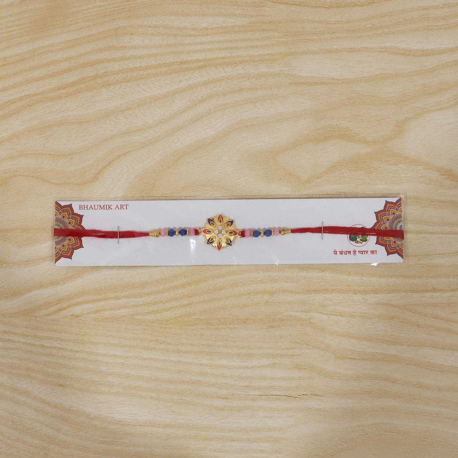 Decorative floral rakhi with intricate beadwork