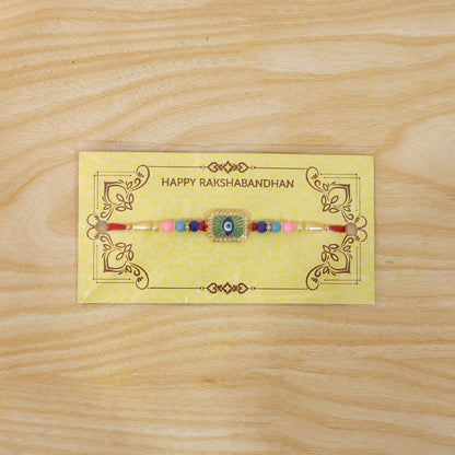 Elegant mint green thread Rakhi with decorative beads