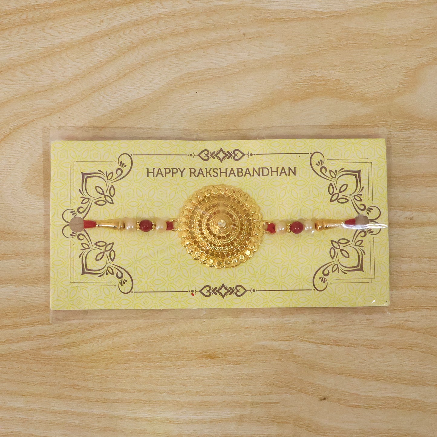 Decorative gold Rakhi ideal for traditional Raksha Bandhan rituals