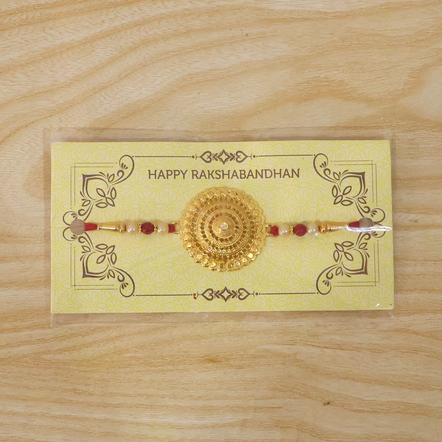 Decorative gold Rakhi ideal for traditional Raksha Bandhan rituals