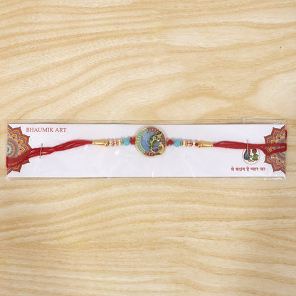 Beautifully crafted Peacock motif Rakhi for sibling celebration