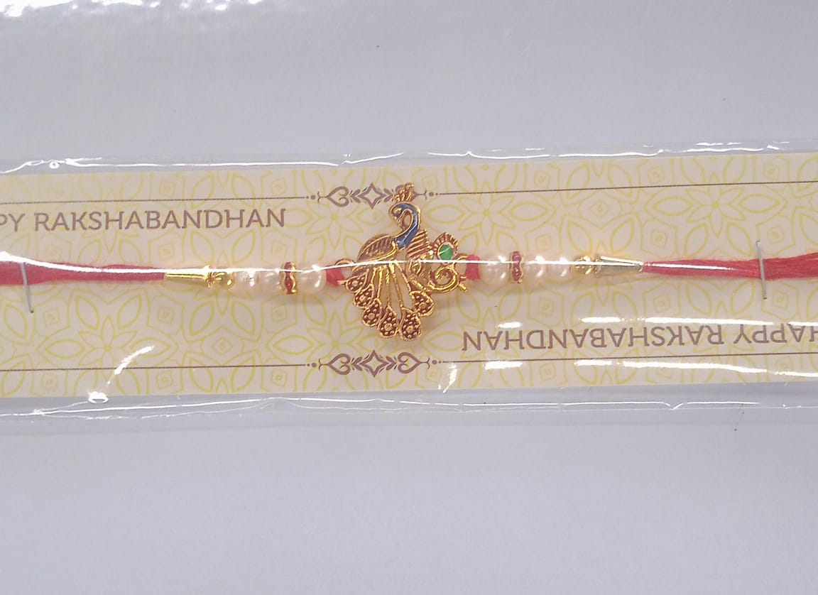 Elegant Peacock Design Rakhi with Pearl Beads and Golden Detailing on Red Thread
