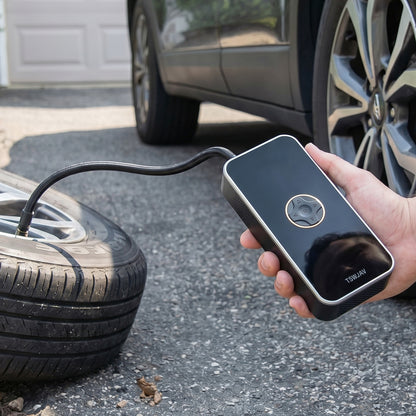 Air pump inflating car tyre
