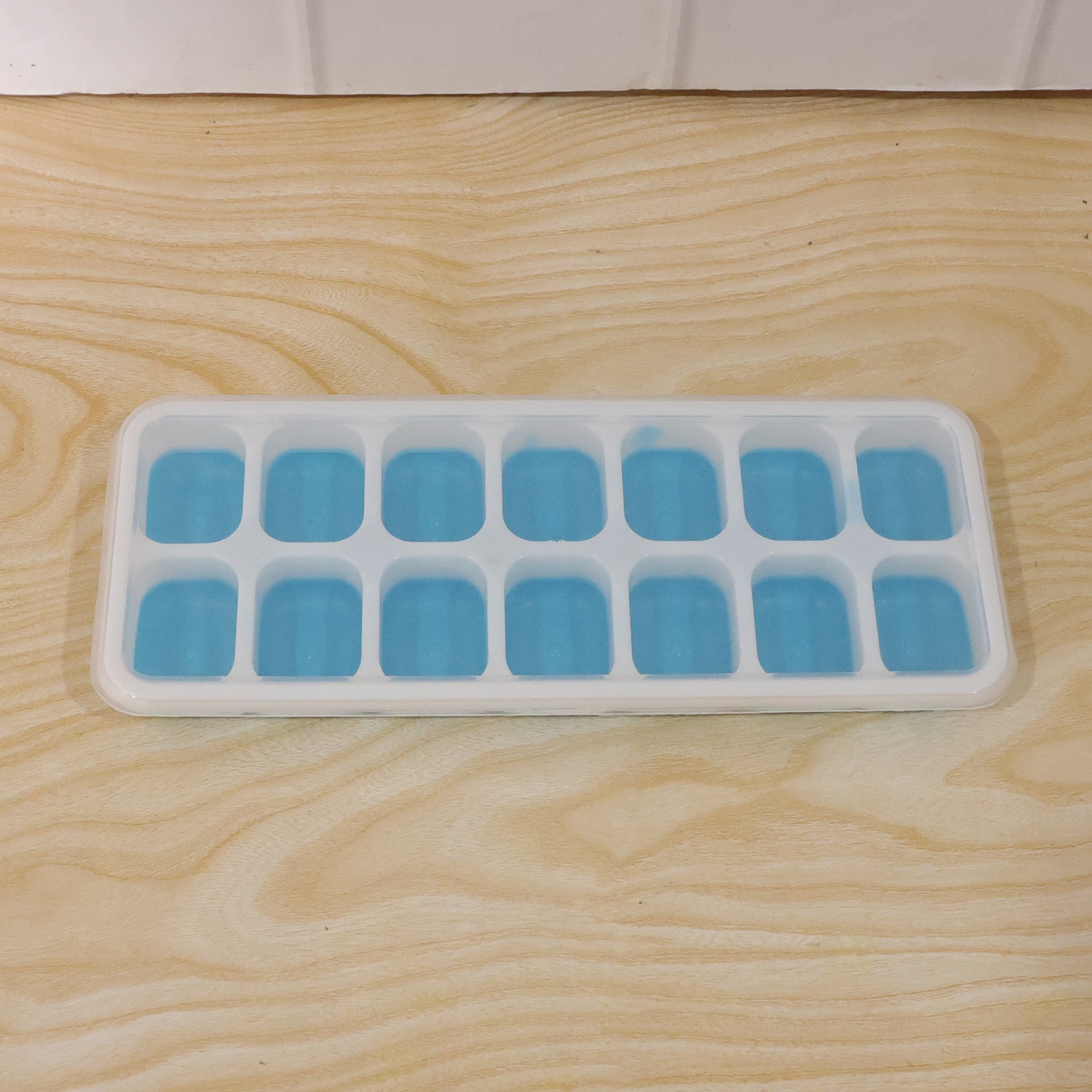 Clear plastic ice cube tray for freezing water