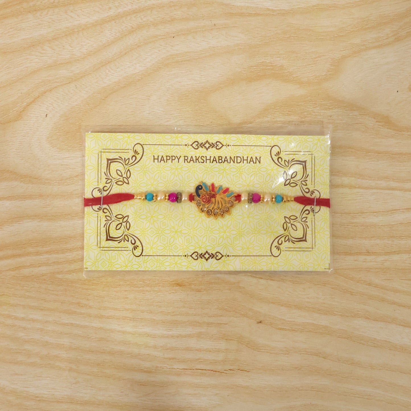 Colorful peacock Rakhi with stones and beads on soft thread