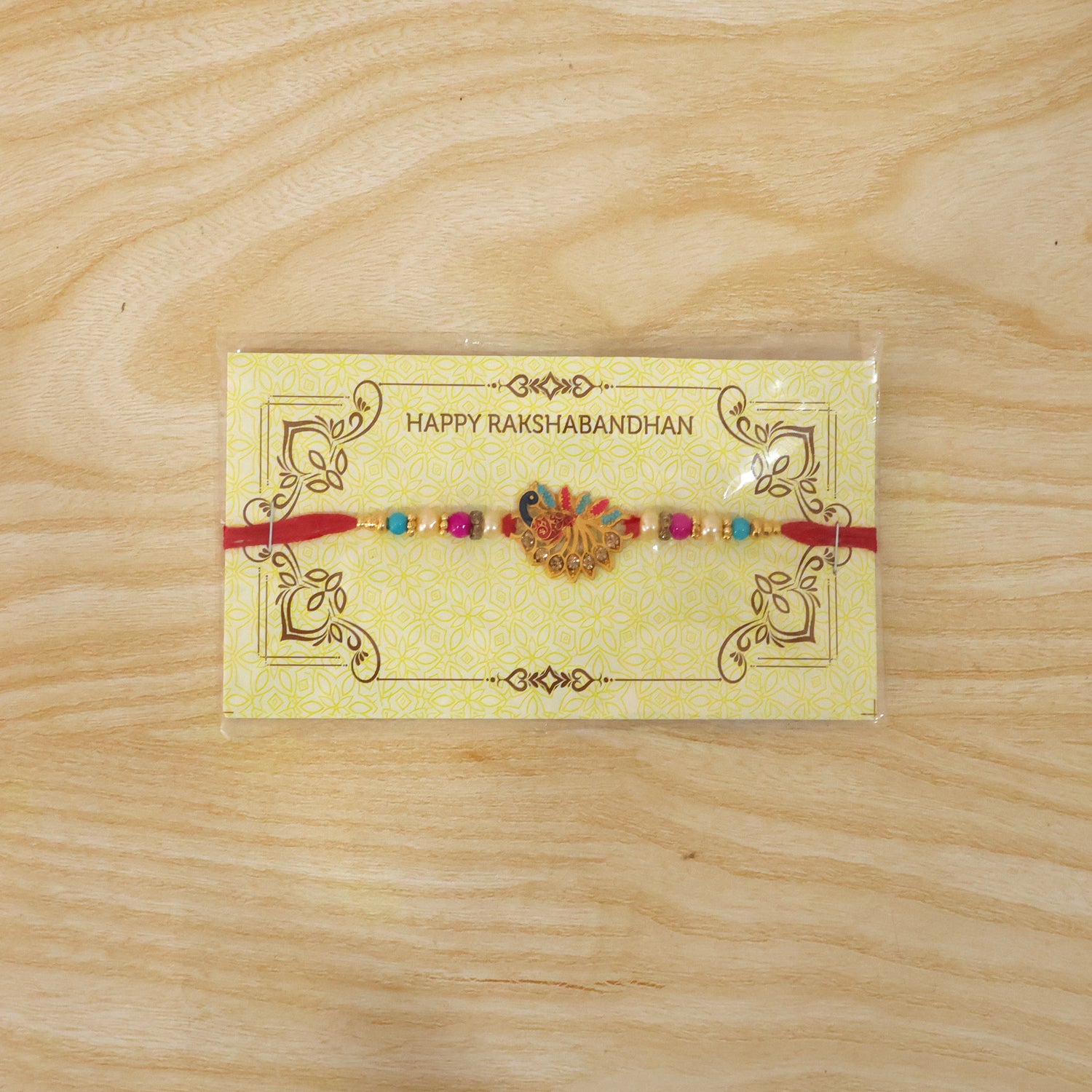 Colorful peacock Rakhi with stones and beads on soft thread