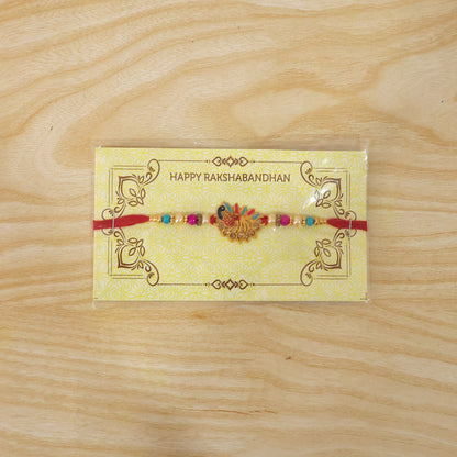 Colorful peacock Rakhi with stones and beads on soft thread