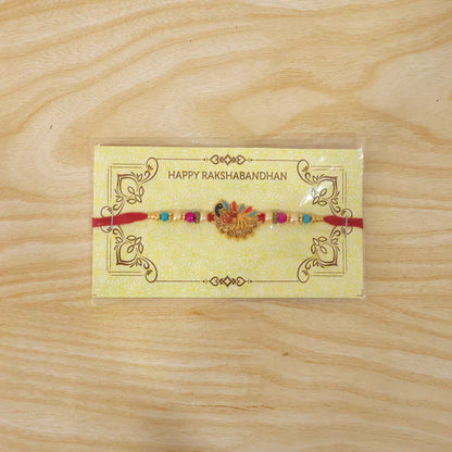 Peacock Rakhi with sparkling stones and comfortable thread, ready for gifting.