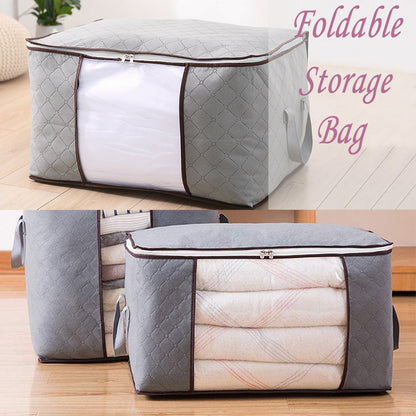 Two grey quilted fabric storage bags, one empty and one filled with folded blankets, on a wooden floor.
