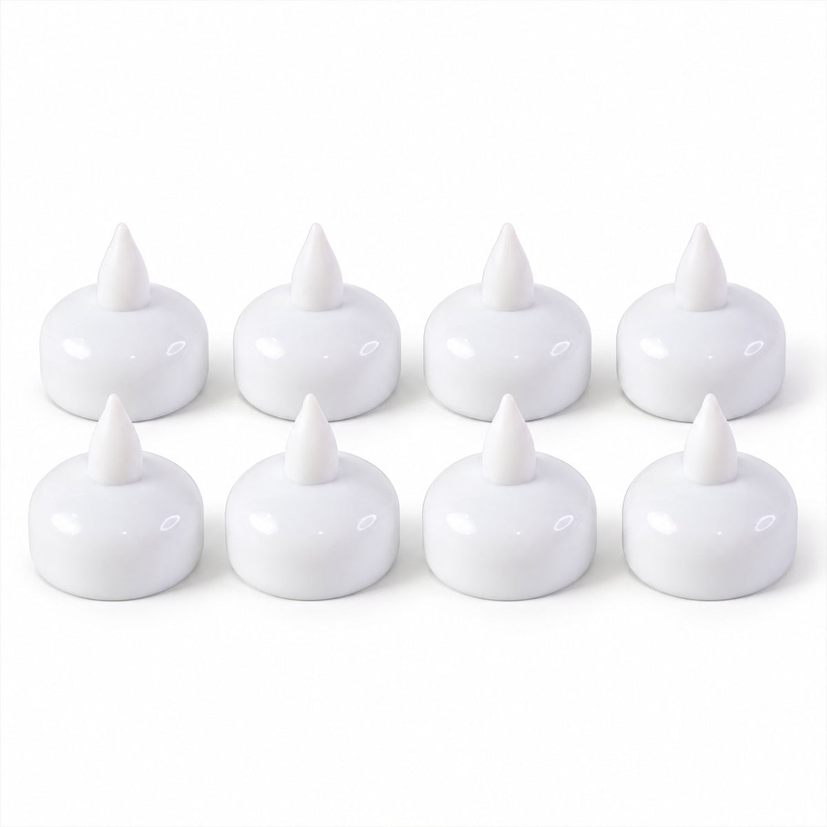 Eight white, unlit floating LED diyas are neatly arranged in two rows on a plain white surface.