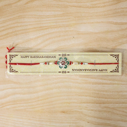 Green Flower Rakhi with Red Beads and Pearl Thread Styling