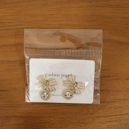 Crystal bow drop earrings worn showcasing sparkling design