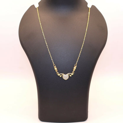 Delicate fine gold chain with gold heart love pendant adorned with CZ stones