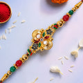 Multicolor Floral Kundan Pendant Rakhi with Red and Green Beads