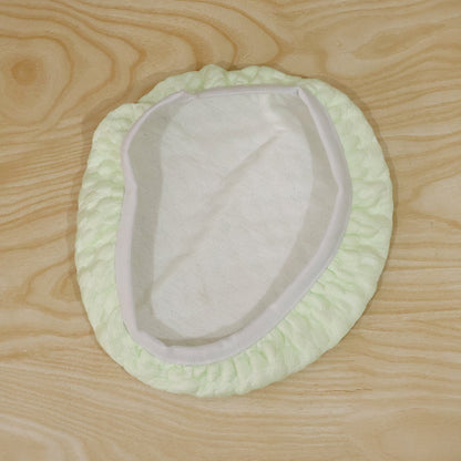 Textured round stool cushion cover folded, showcasing texture