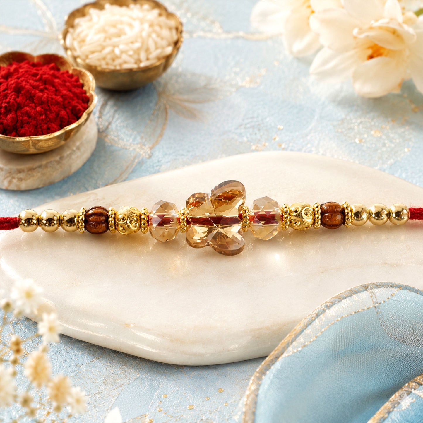 Crystal Flower Cluster Rakhi with Faceted Stones, Golden Accents and Red Thread