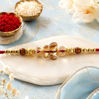 Crystal Flower Cluster Rakhi with Faceted Stones, Golden Accents and Red Thread