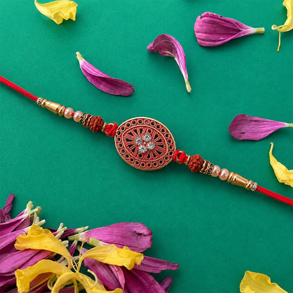 Round Red Chakra Rakhi with Golden Beads and Pearl Side Work