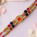 Red Blue Beaded Rakhi with Ruby Center and Rich Traditional Festive Gift Styling