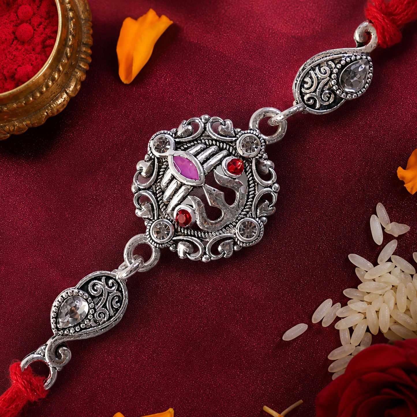 Premium Rakhi showcasing Silver Om Leaf Charm, gold trims and chain look for Gift
