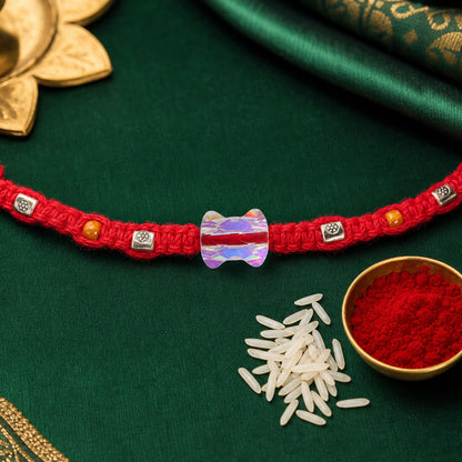 Red Braided Rakhi with an Iridescent Bow-Tie Shaped Crystal Bead