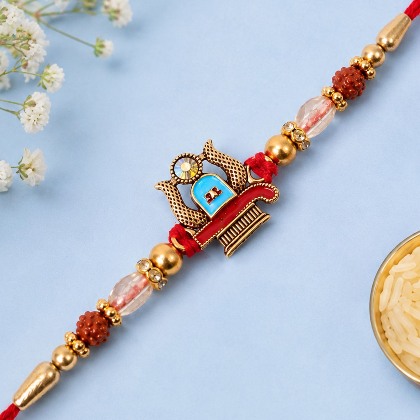 Shivling Pendant Rakhi with Blue Enamel Accent and Rudraksha Beads