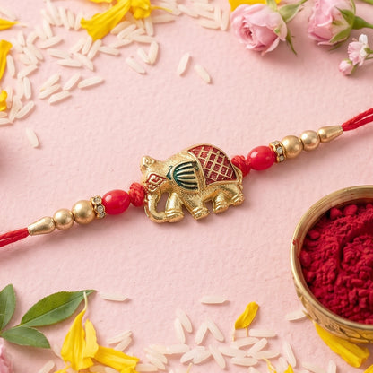 Gold Elephant Rakhi with Red Beads and Pearl Side Detailing
