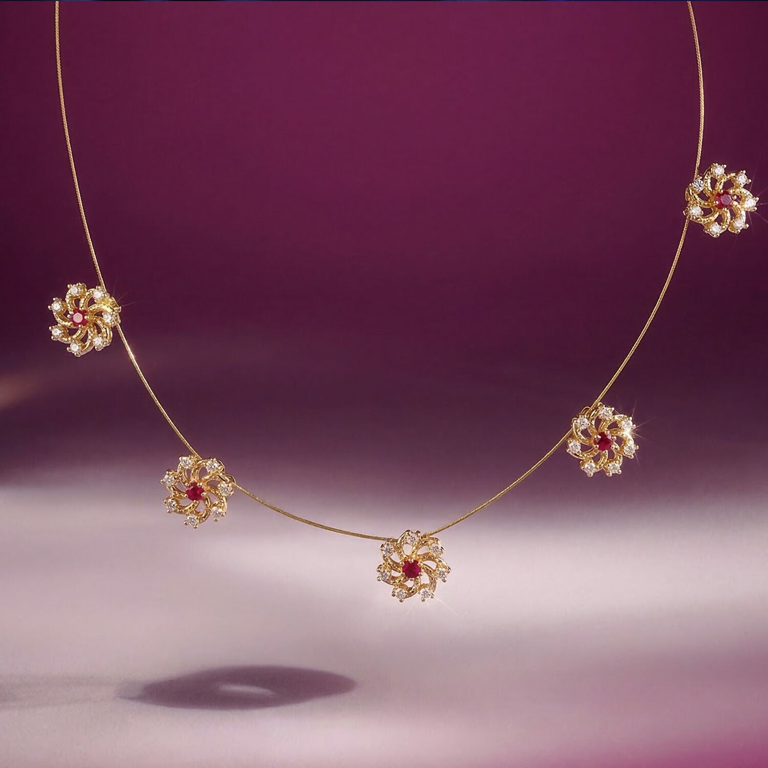 Ruby Floral Station Necklace with Diamond Detailing and Elegant Gold Chain Design