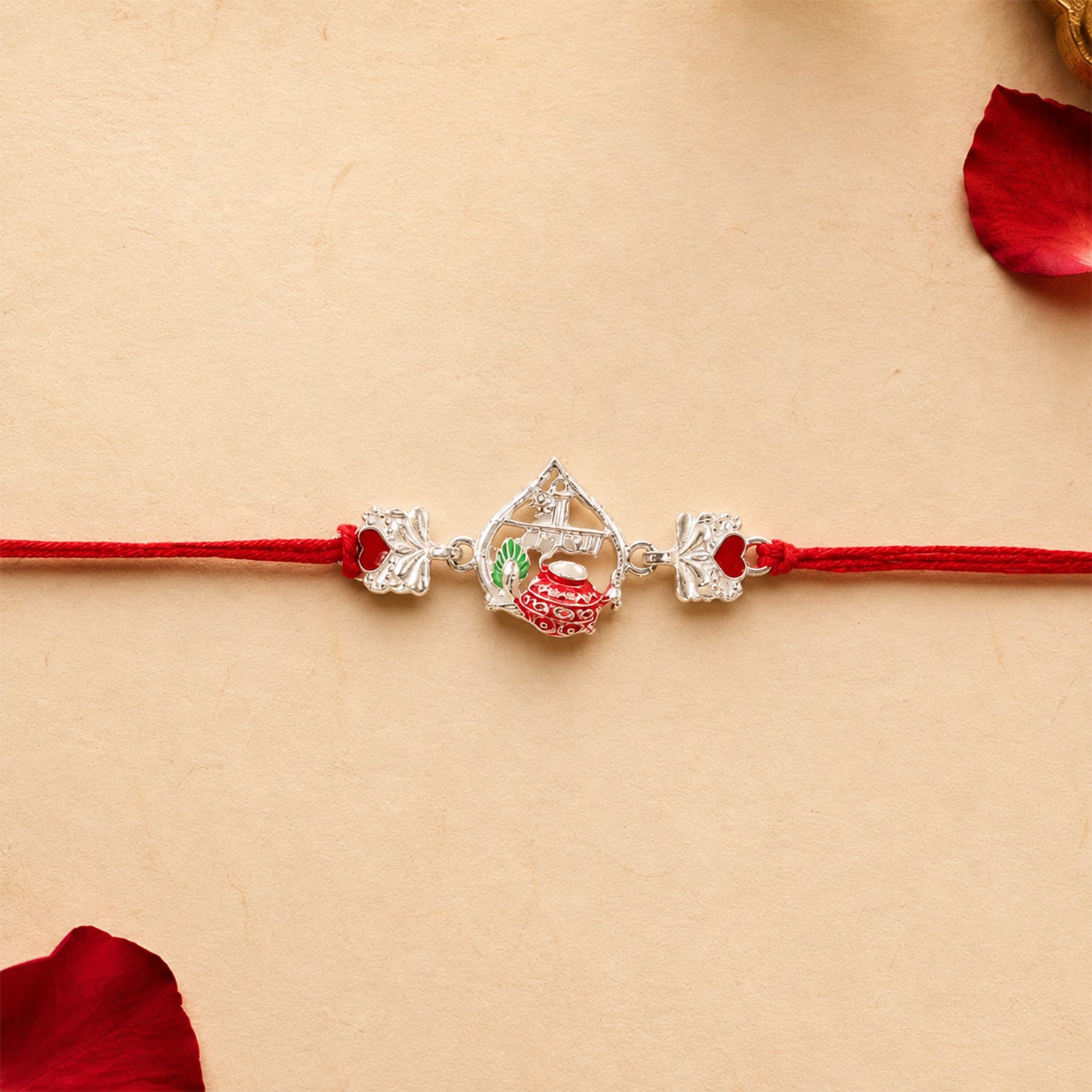 Silver Crown Rakhi with Pink Stone Center and Red Mauli Thread