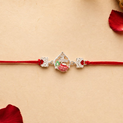 Silver Crown Rakhi with Pink Stone Center and Red Mauli Thread