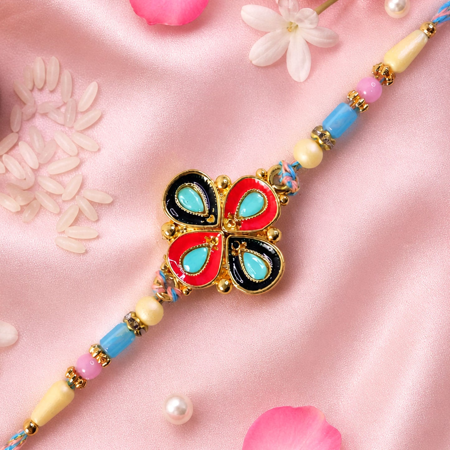 Four-Petal Floral Rakhi with Cream Thread, Multicolor Enamel and Floral Motif Design