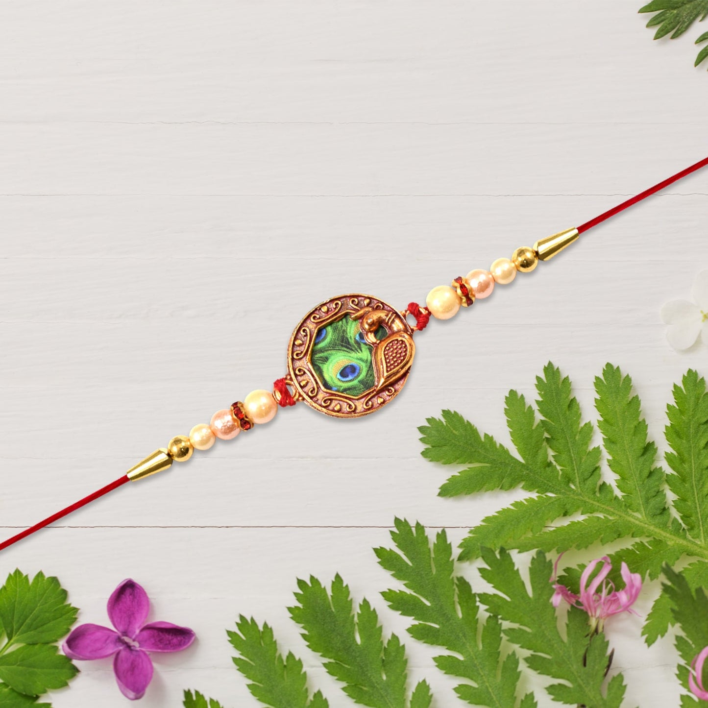 Shop Peacock Feather Rakhi with Pearl Bead Accents Red Thread (5pcs)