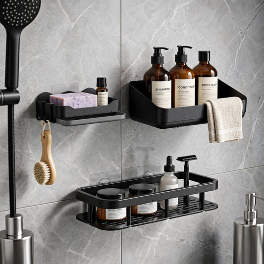 Three black plastic shower caddies with various toiletries on a grey tiled wall, with a shower head visible.