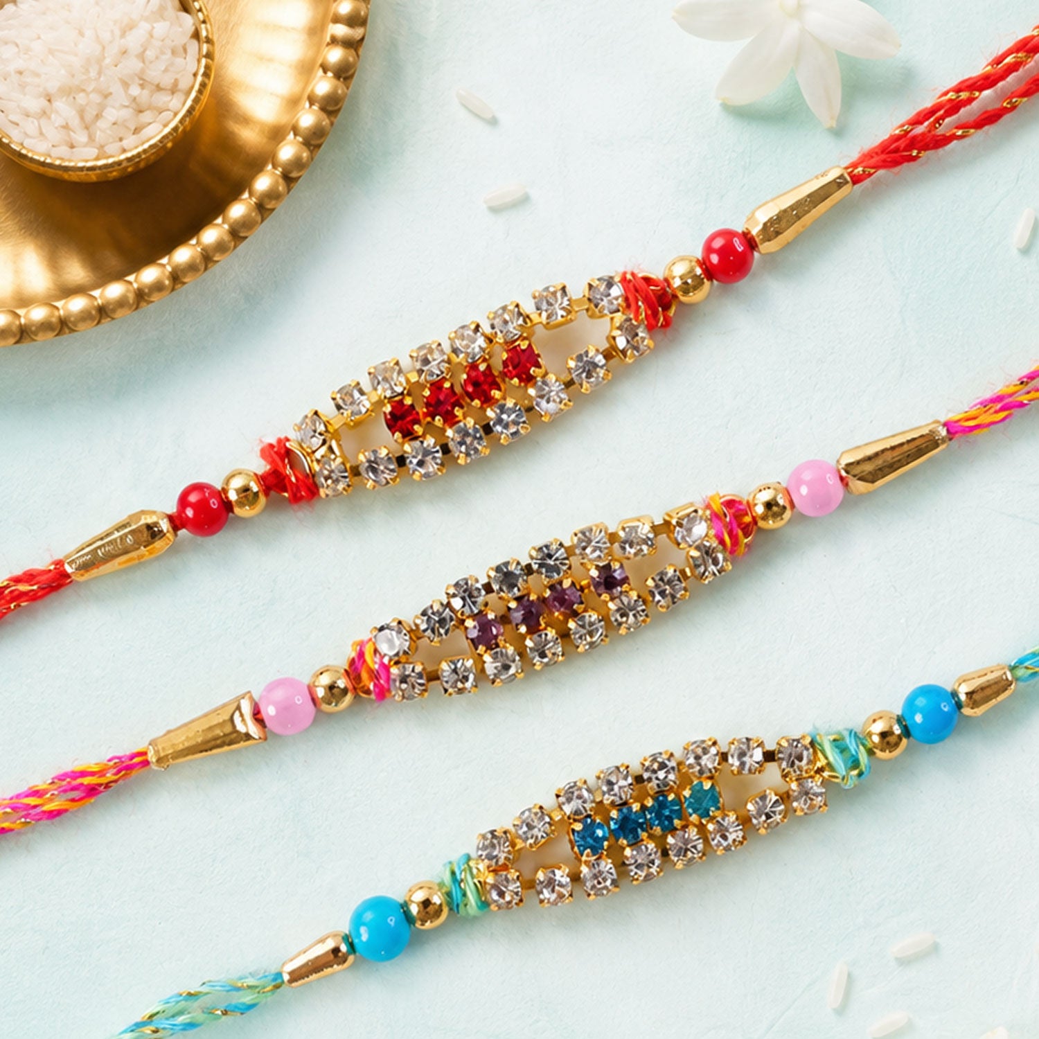 Pointed Oval Motif Rakhi with Shimmering AD Stones (Pack of 6)