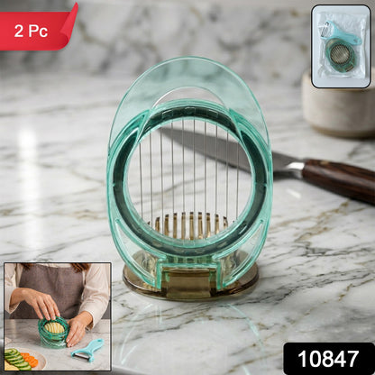 Person using the manual vegetable slicer to cut carrots