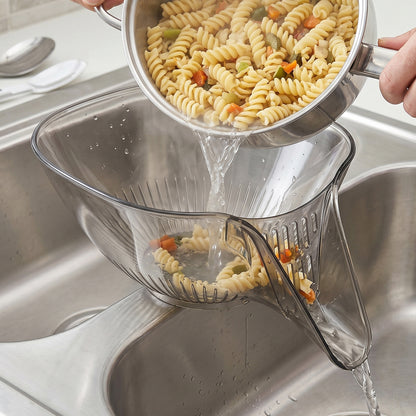 Strainer basket placed inside kitchen sink for washing