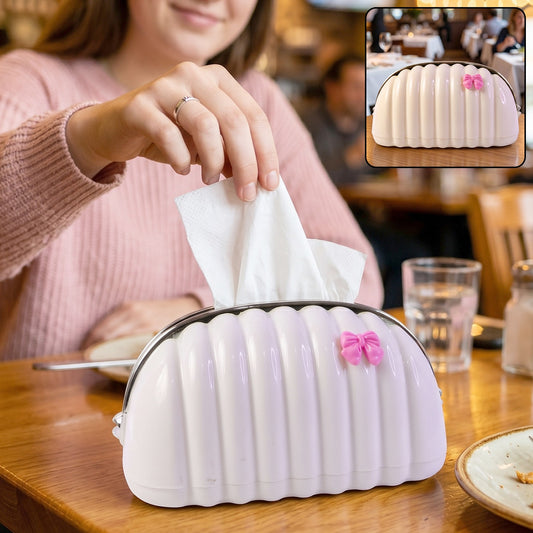 Shell shape tissue dispenser with pink bow and chrome rim