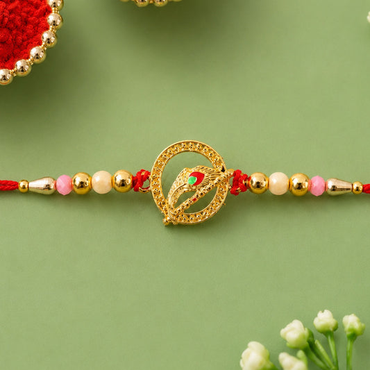 Golden Peacock Spiral Beads Rakhi – Elegant & Traditional Design