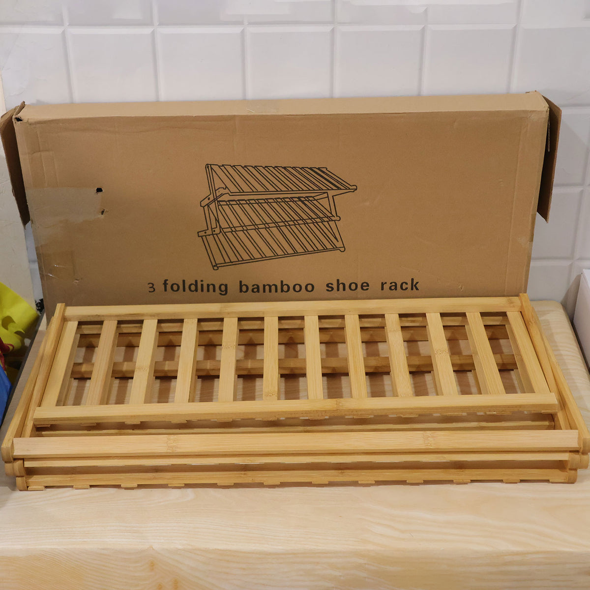 Foldable three layer bamboo storage rack - actual product and brown box