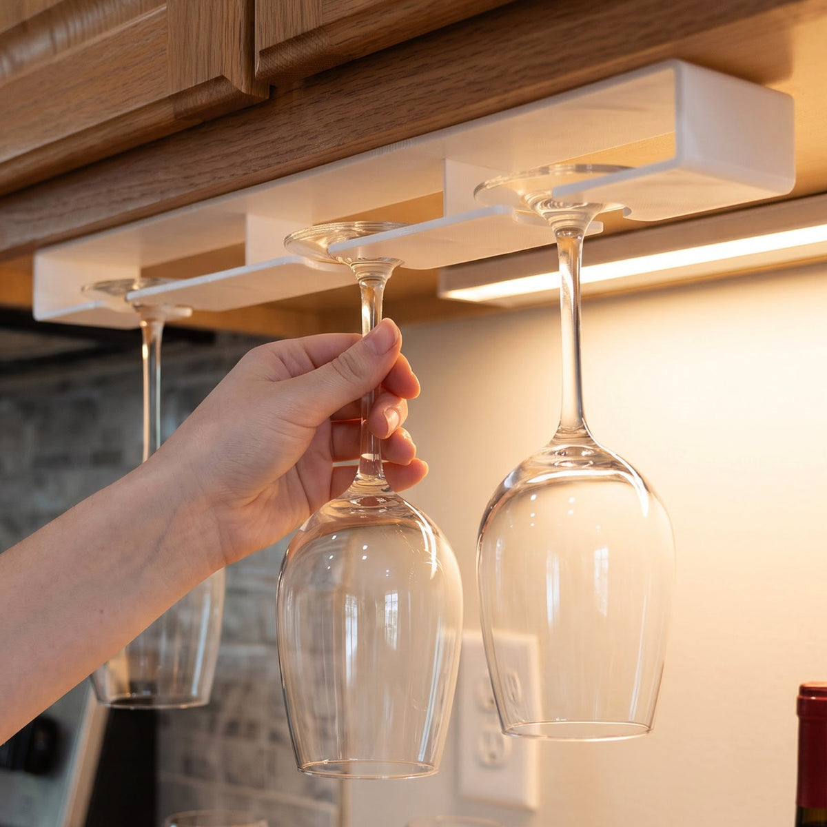 Stemmed glass sliding into under cabinet holder