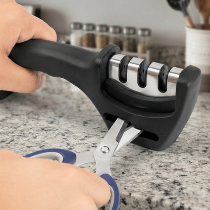 Three stage manual knife sharpener on white background